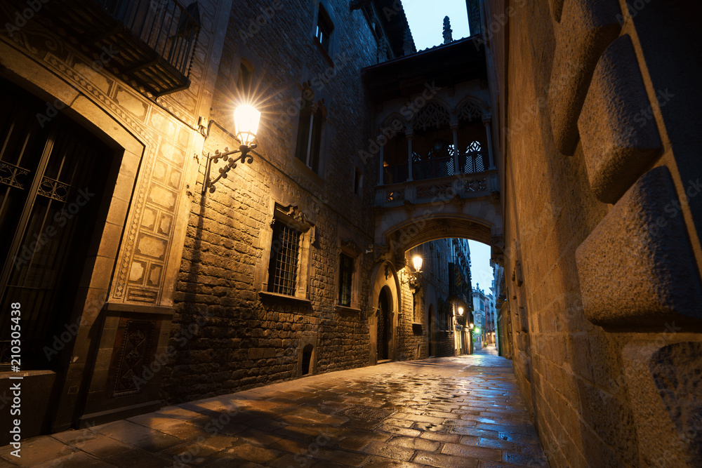 Barri Gothic Quarter and Bridge of Sighs at night in Barcelona, Catalonia, Spain..
