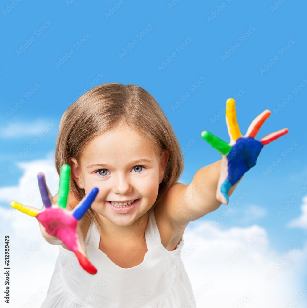 Little girl with colorful painted hands