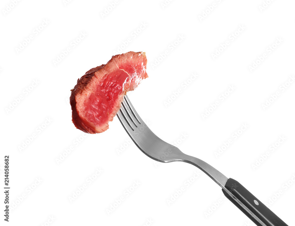 Fork with piece of cooked meat on white background