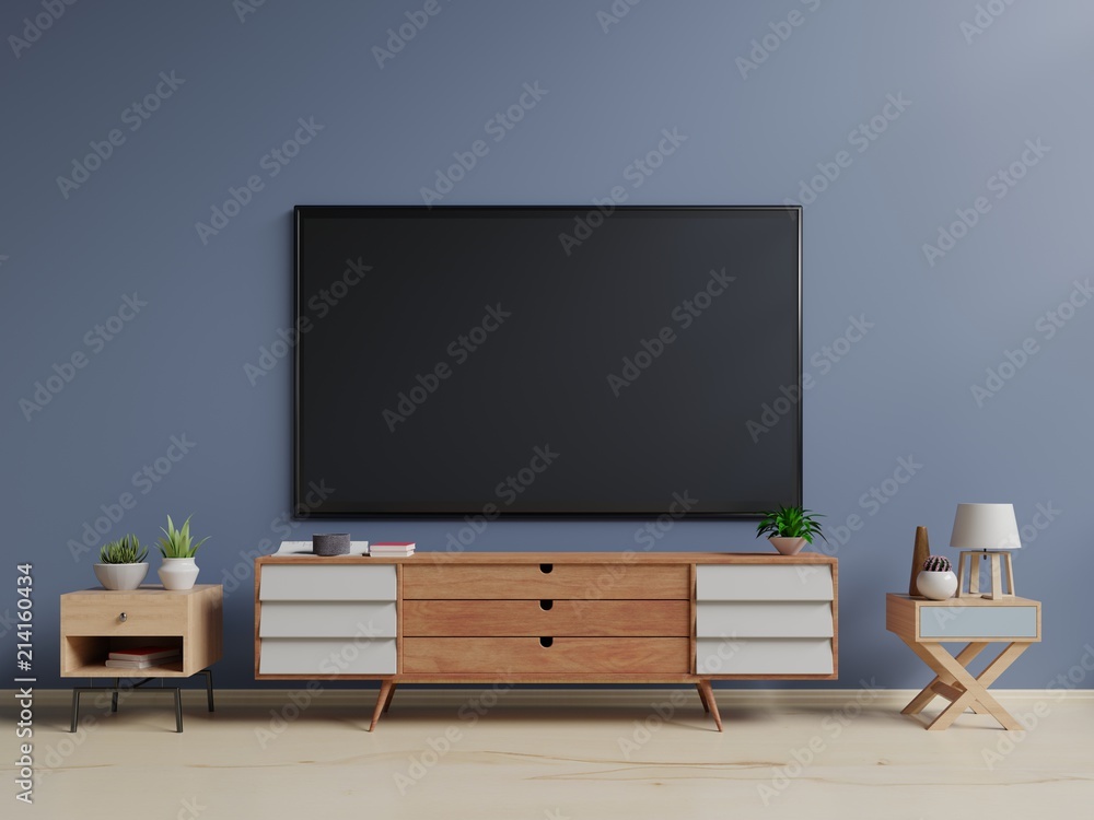 客厅深色墙上的智能电视，带橱柜、植物、灯，最小设计，三维渲染