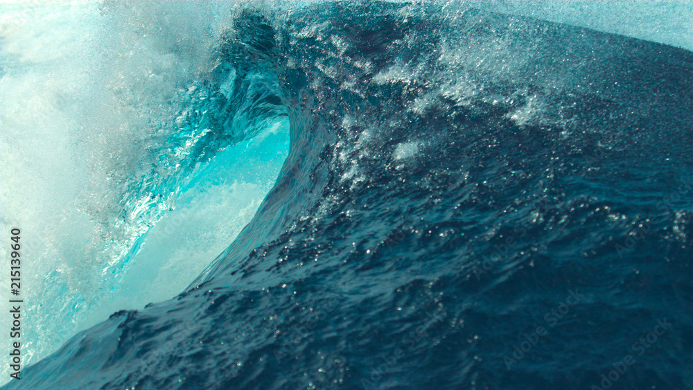 CLOSE UP: Picturesque emerald barrel wave splashes and sprays glassy ocean water