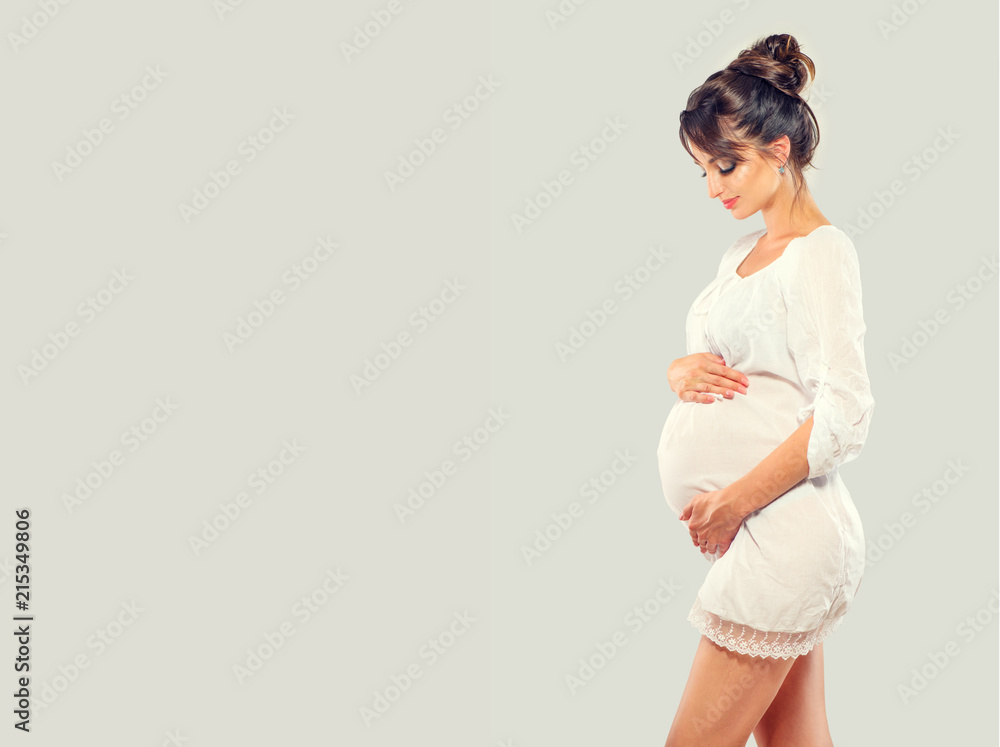 Pregnant happy woman touching her belly. Pregnant beauty young mother portrait, caressing her belly 