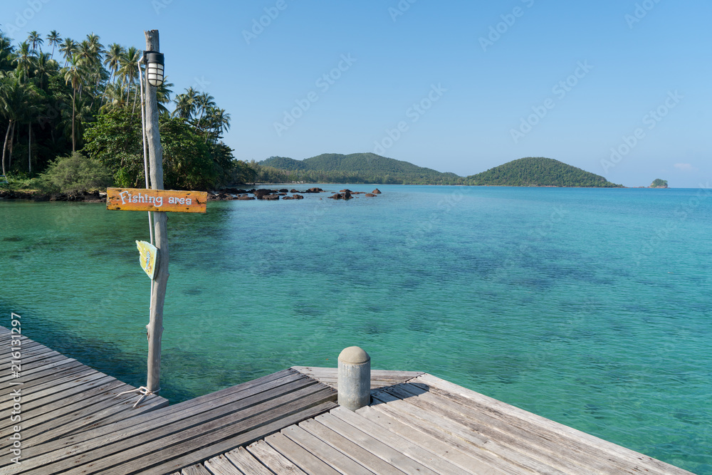 Wooden pier with summer blue sea and sky background in Phuket, Thailand. Summer, Vacation, Travel an