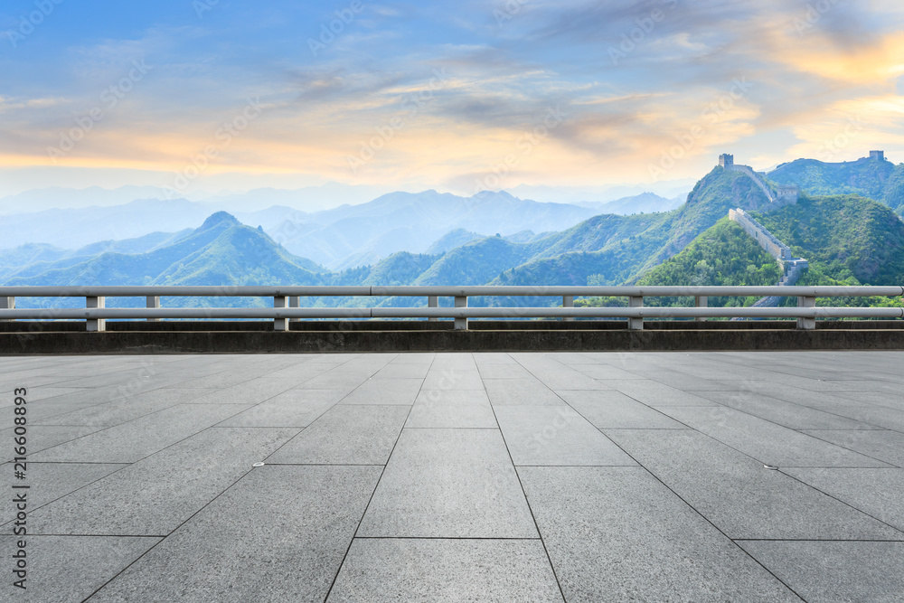 Square floor and and great wall with mountains at sunset