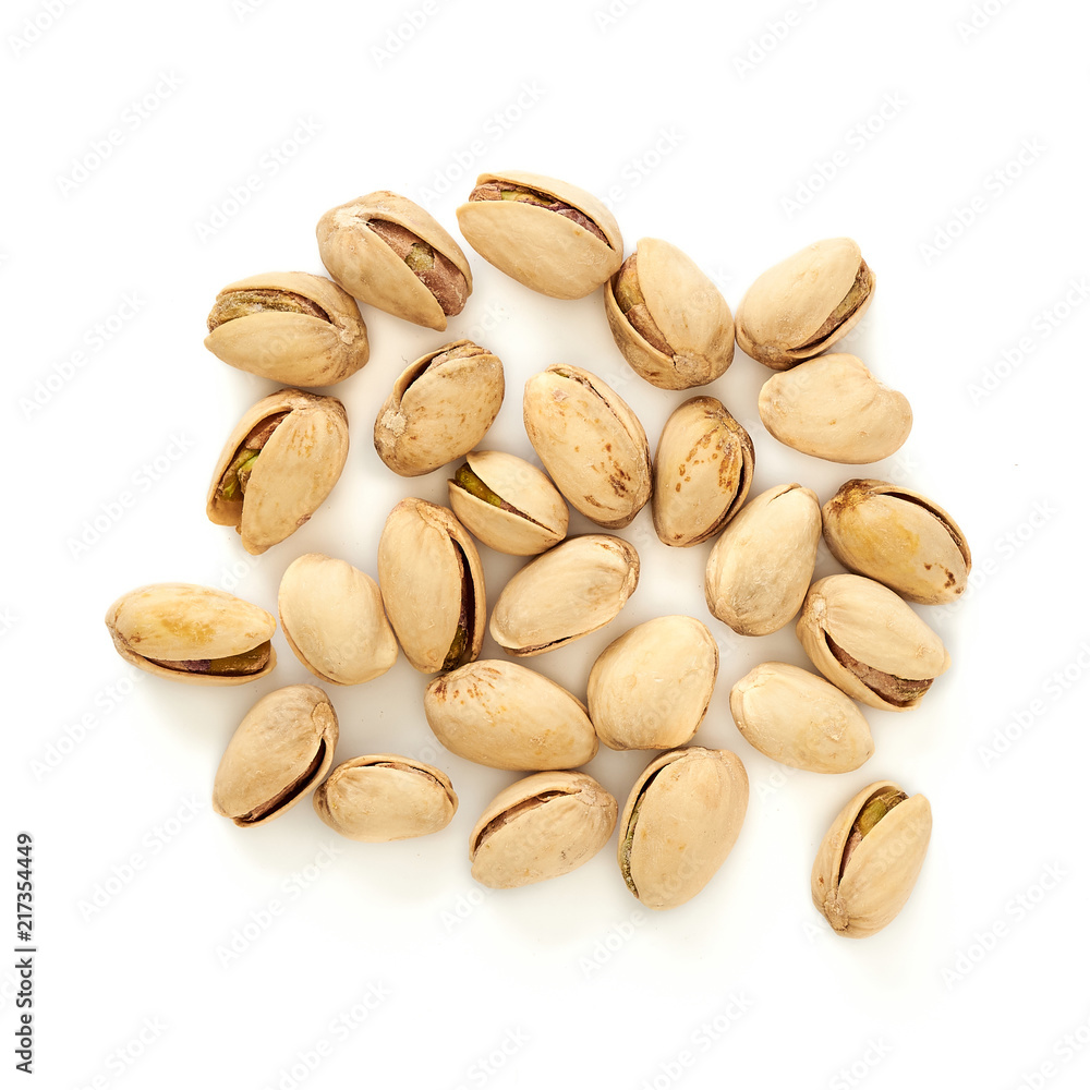 Salted pistachios isolated on white background. Top view.