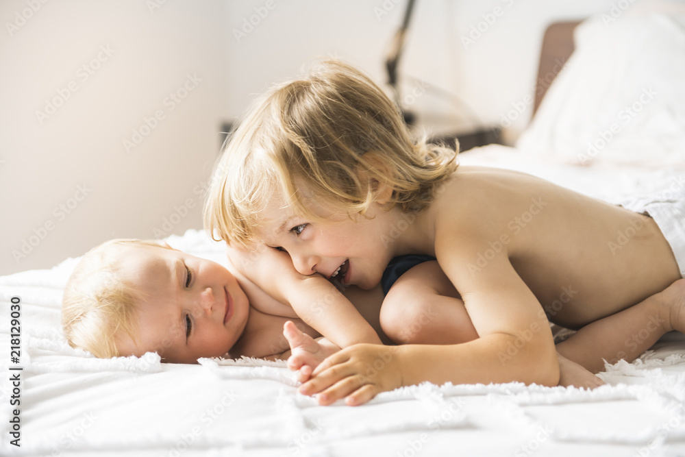 baby in bed with his brother son