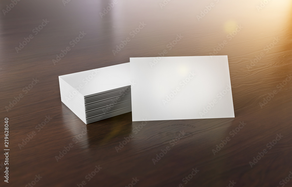 木制办公桌上的白色名片堆叠3D渲染