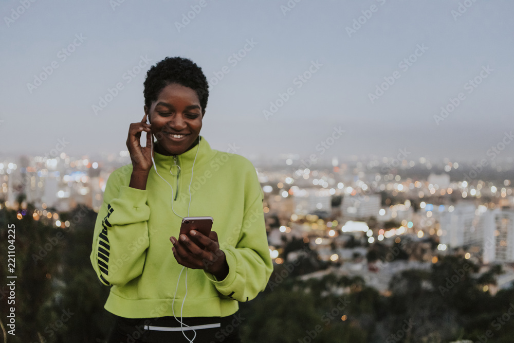 Woman listening to music from a phone