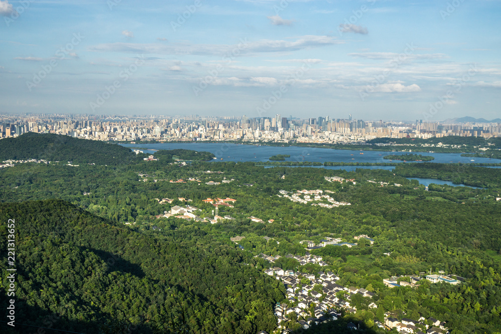 landscape of west lake with hangzhou city skyline