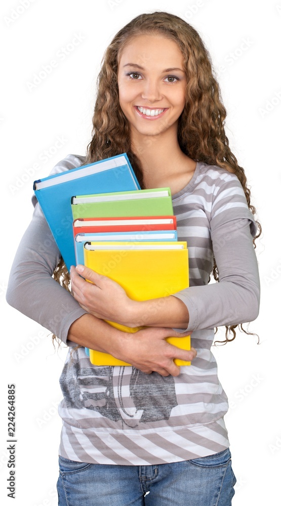 Friendly Young Girl Standing and Holding Books - Isolated
