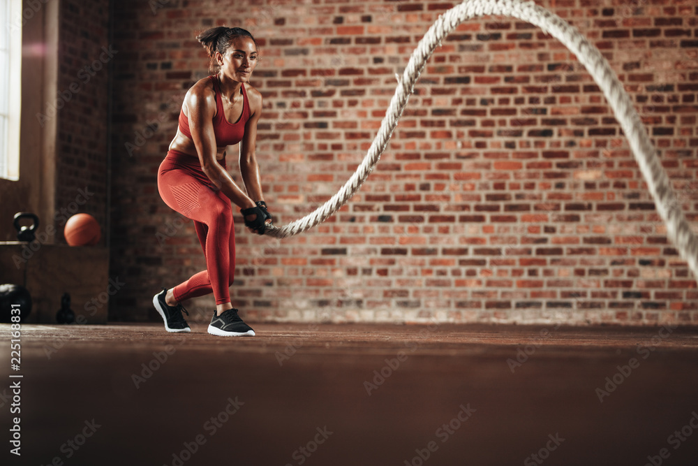 Woman doing cross training routine