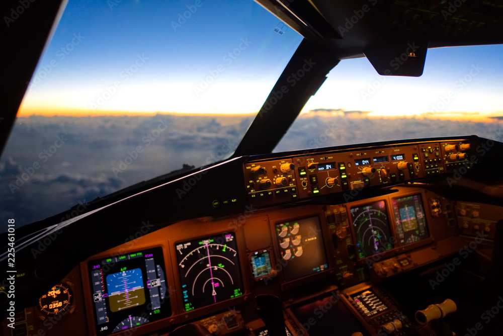The view from commercial airplane, seen from captain seat in cockpit in the morning twilight during 