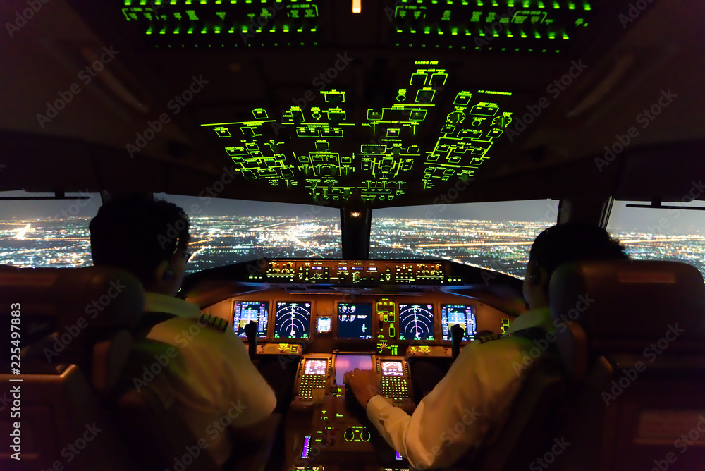 Asian airline pilots were operating commercial aircraft on approach phase over city on the night. Bo