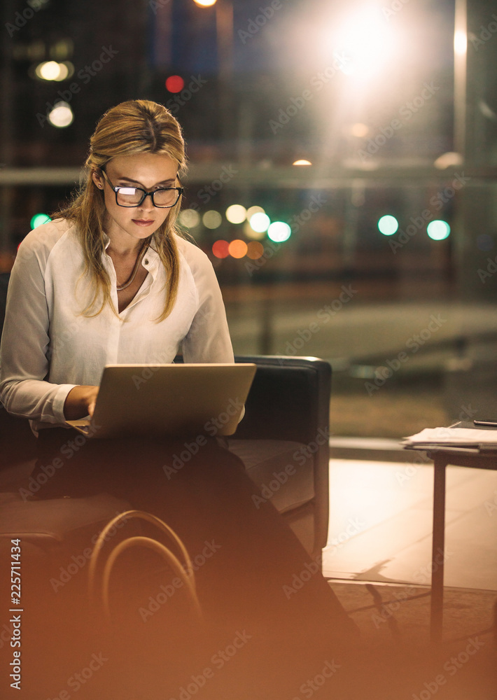 Businesswoman working late in office to complete the project