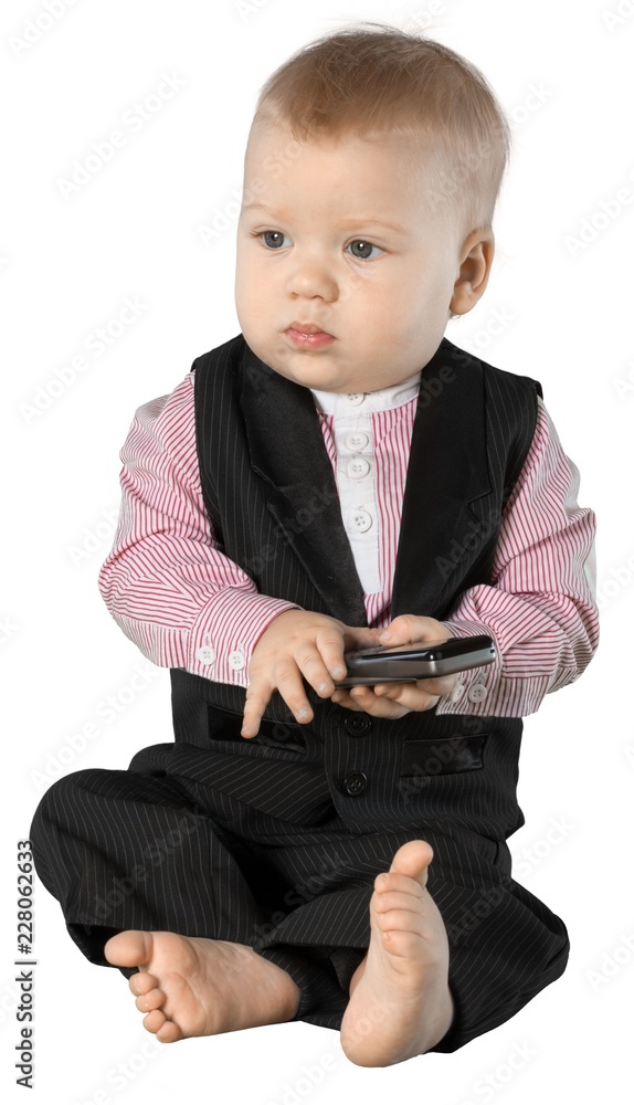 婴儿商务坐在手机旁-隔离