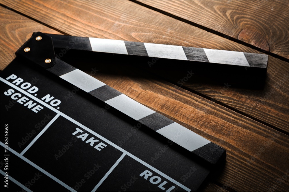 Movie clapper board and film tapes
