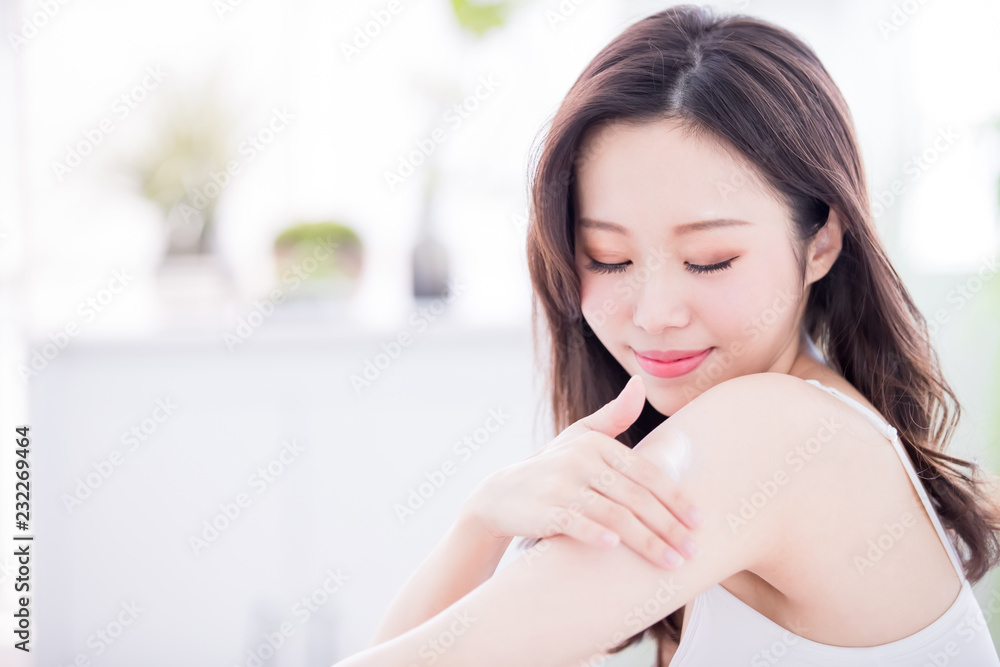skin care woman applying lotion