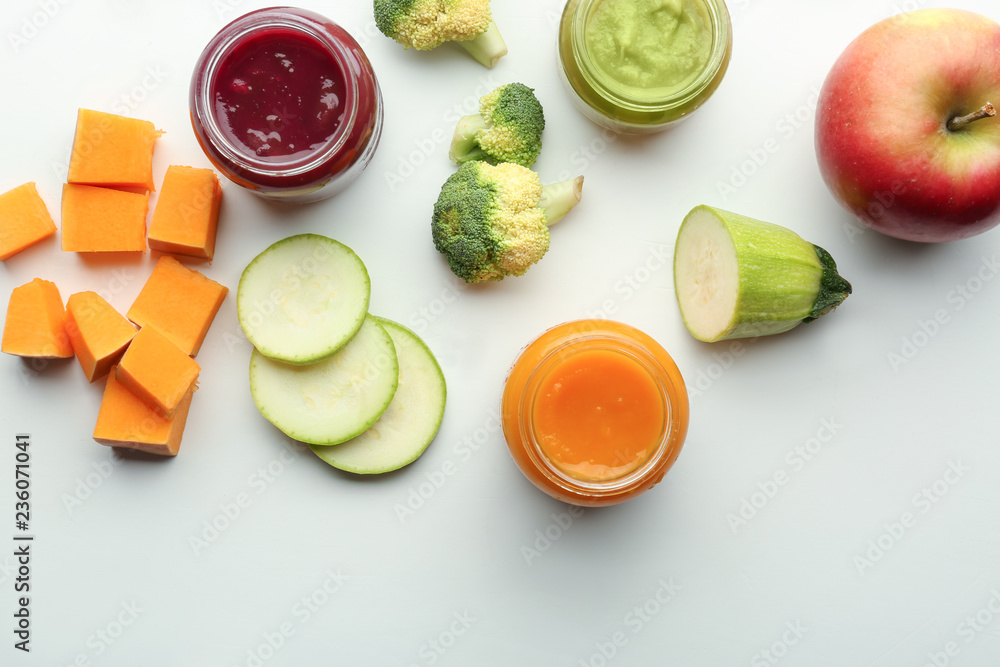 Flat lay composition with healthy baby food and ingredients on white background