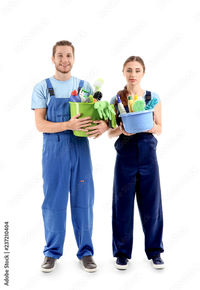 Man and woman with cleaning supplies on white background