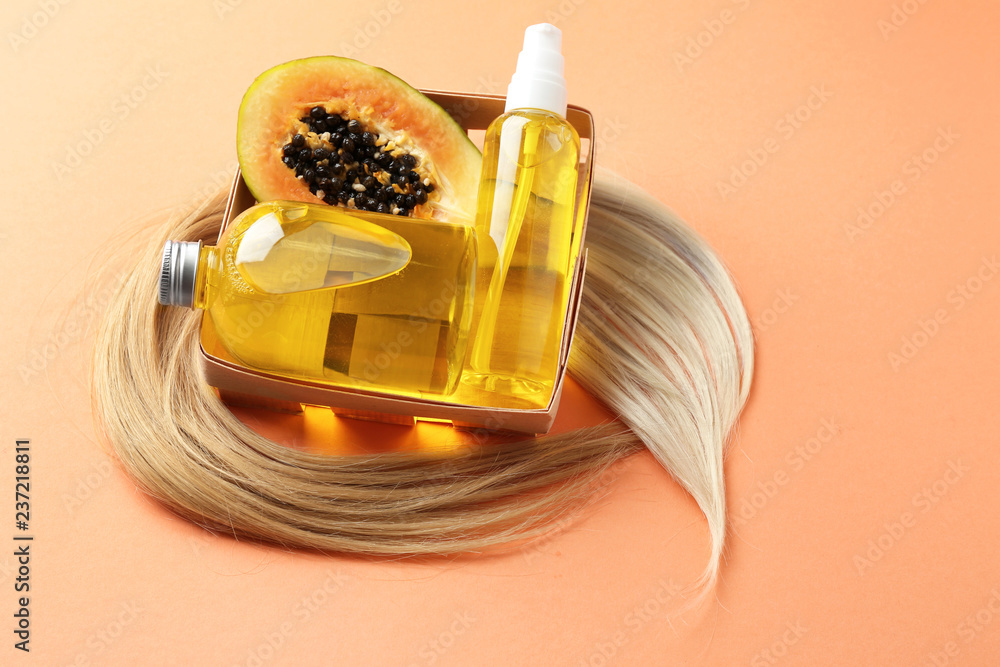 Composition with papaya and natural cosmetics for hair on color background