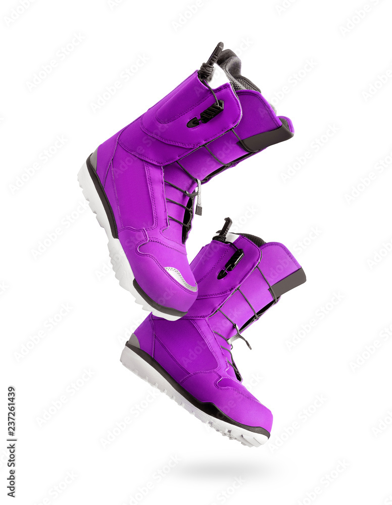 Technological purple snowboard boots isolated on a white background