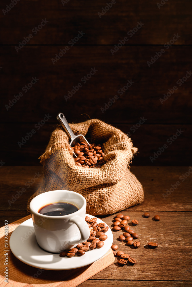 A shot of espresso with roasted coffee bean