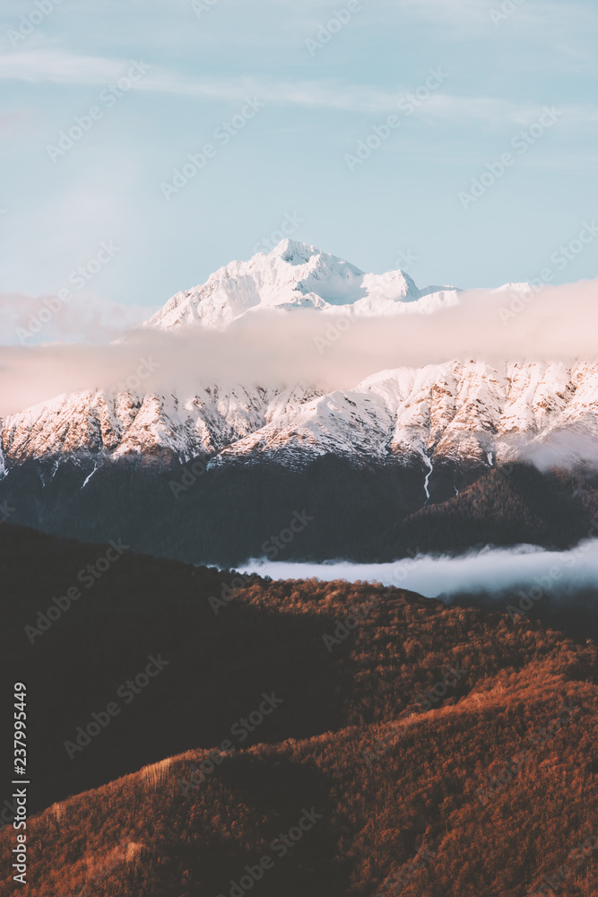 Snowy mountains peak and sunset clouds Landscape Travel aerial view wilderness nature tranquil eveni