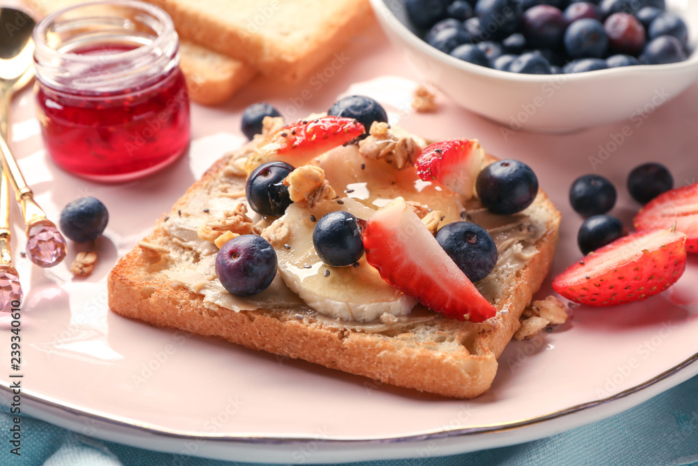 Sweet toast with berries and fruit on plate, closeup