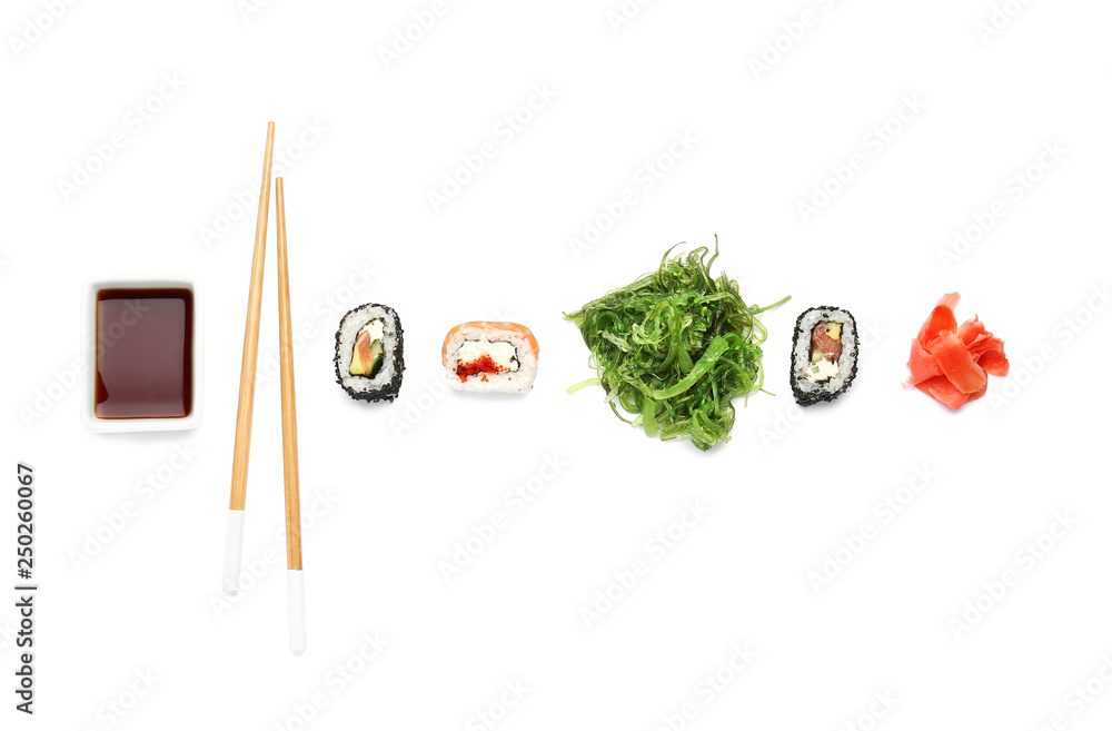 Composition with tasty sushi rolls on white background