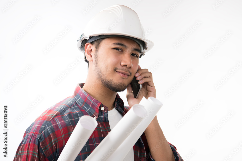 Portrait of asian engineer holding blueprint smiling and using a cellphone isolated on white backgro