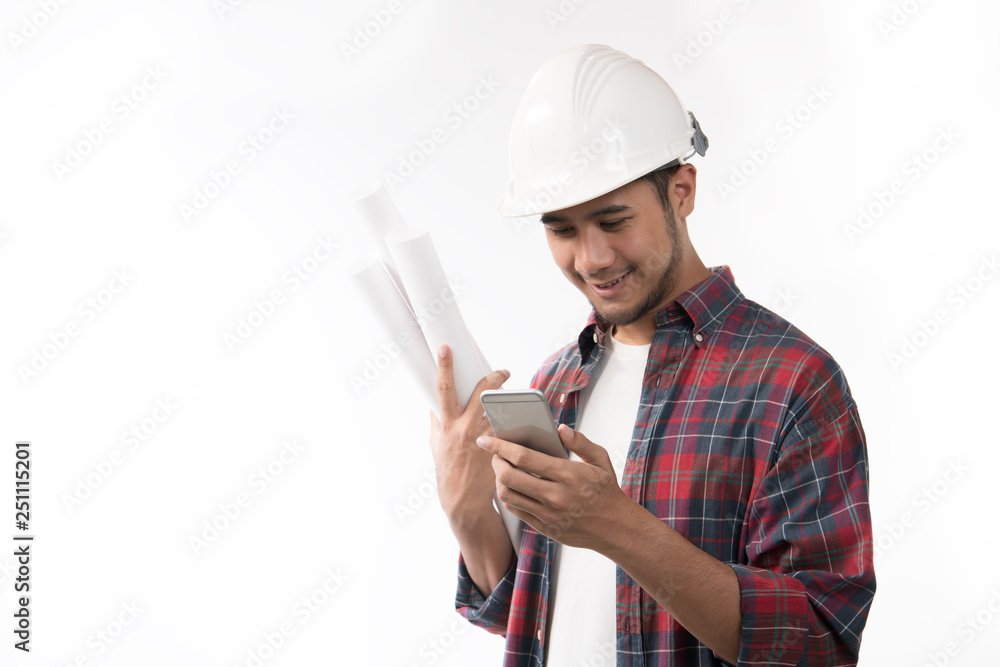 Portrait of asian engineer holding blueprint and using a cellphone isolated on white background