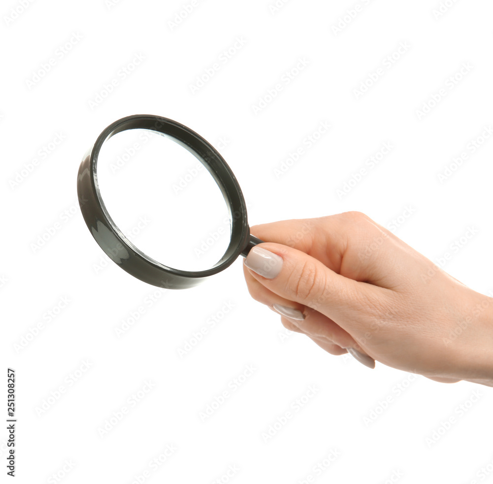 Female hand with magnifier on white background