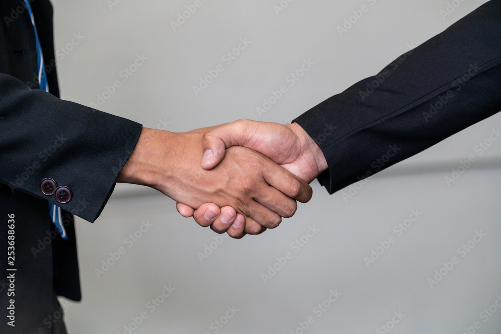 Business people agreement concept. Businessman do handshake with another businessman in the office m