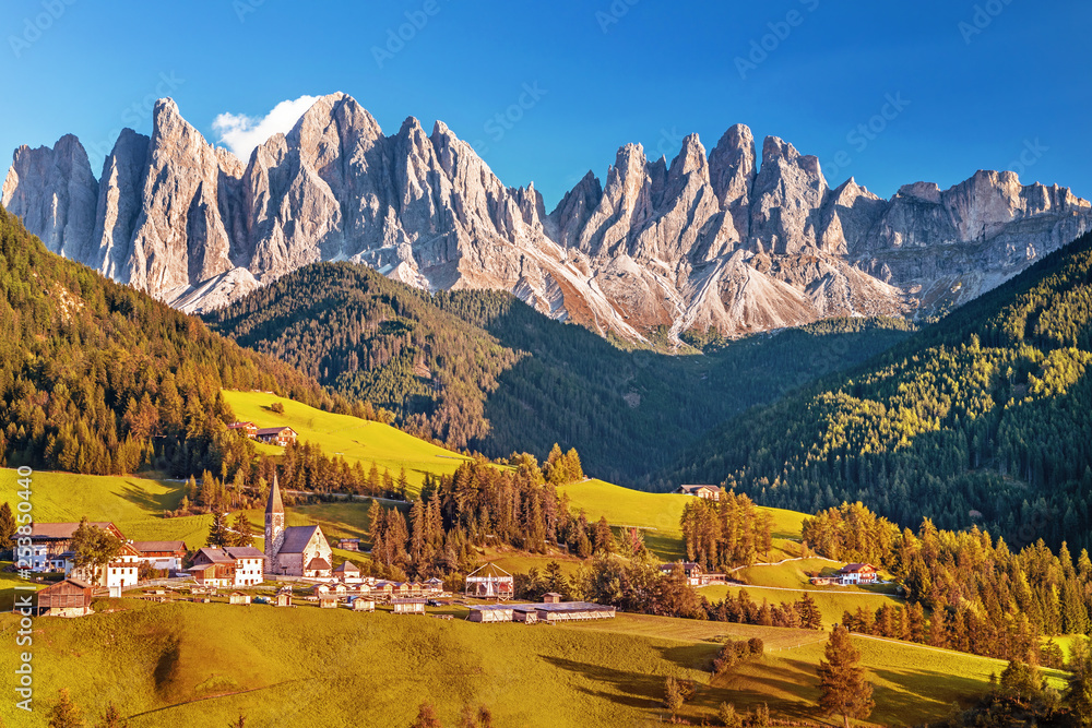 Famous alpine place  Santa Maddalena village with magical Dolomites mountains in background, Val di 