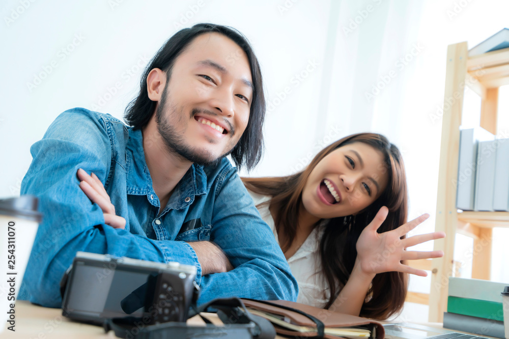 asian couple blogger enjoy communication lives with camera house background concept