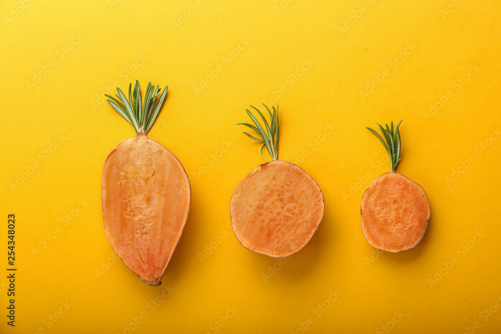Raw cut sweet potato on color background
