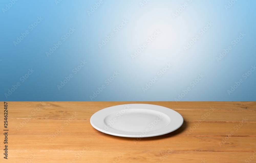 White Plate on napkin on wooden table