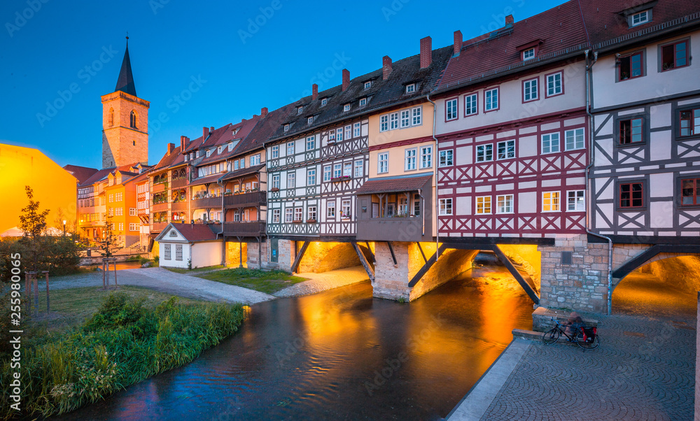 Historic city center of Erfurt with famous Krämerbrücke bridge illuminated at twilight, Thüringen, G
