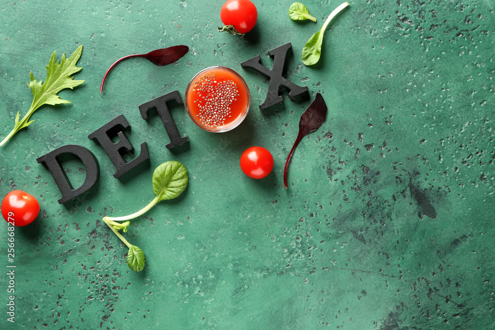 Word DETOX with tomatoes and herbs on color background