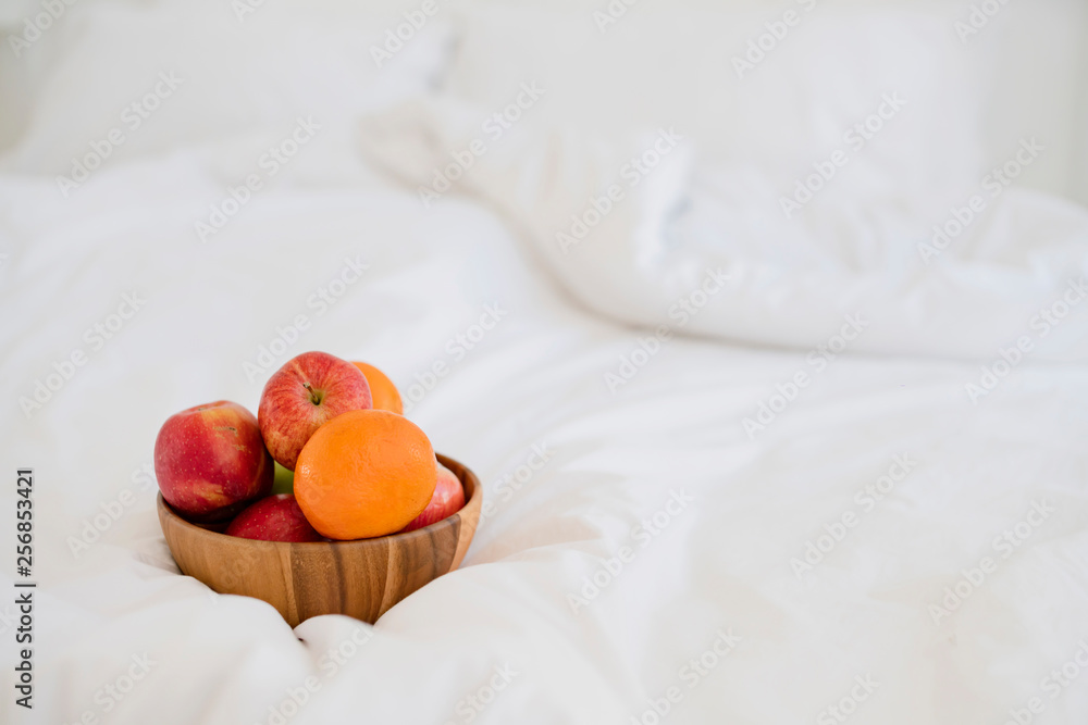 fresh fruit on wooden bowl on white bed morning healthy lifestyle
