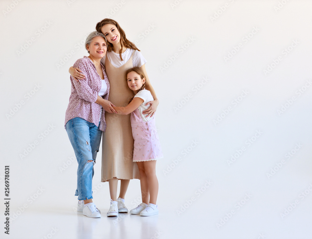family three generations  grandmother, mother and child on white background