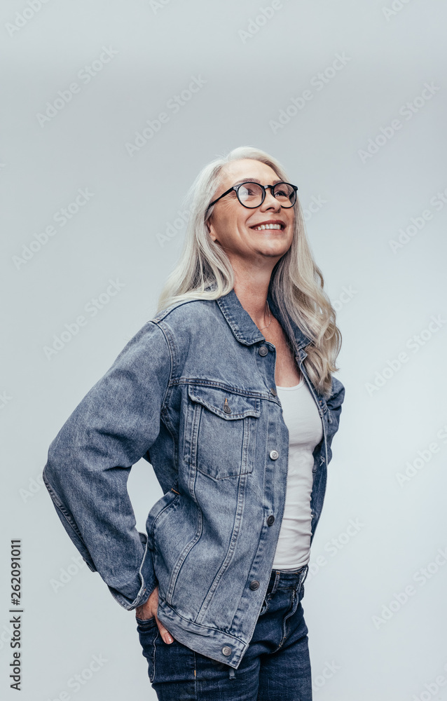 Stylish senior woman looking at copy space