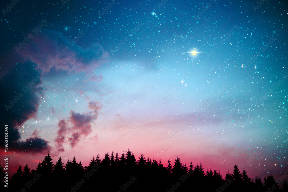 Colorful dramatic sky with stars .