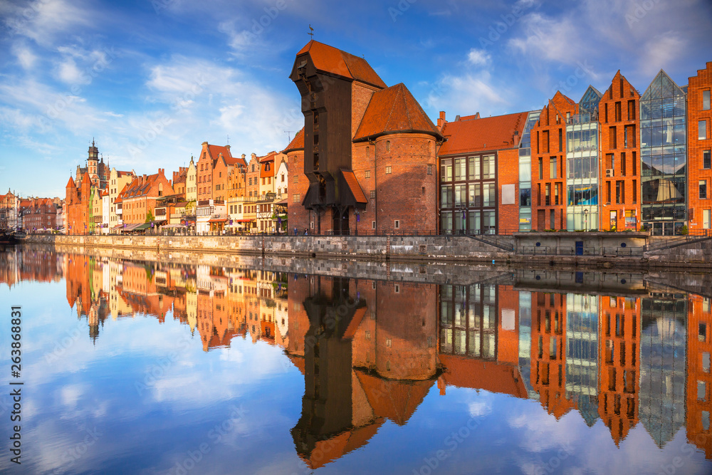 Old town of Gdansk reflected in the Motlawa river at sunrise, Poland.