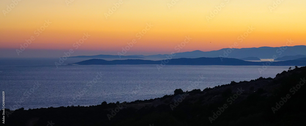 DRONE: Early morning sunrise illuminates the rugged landscape of a remote island