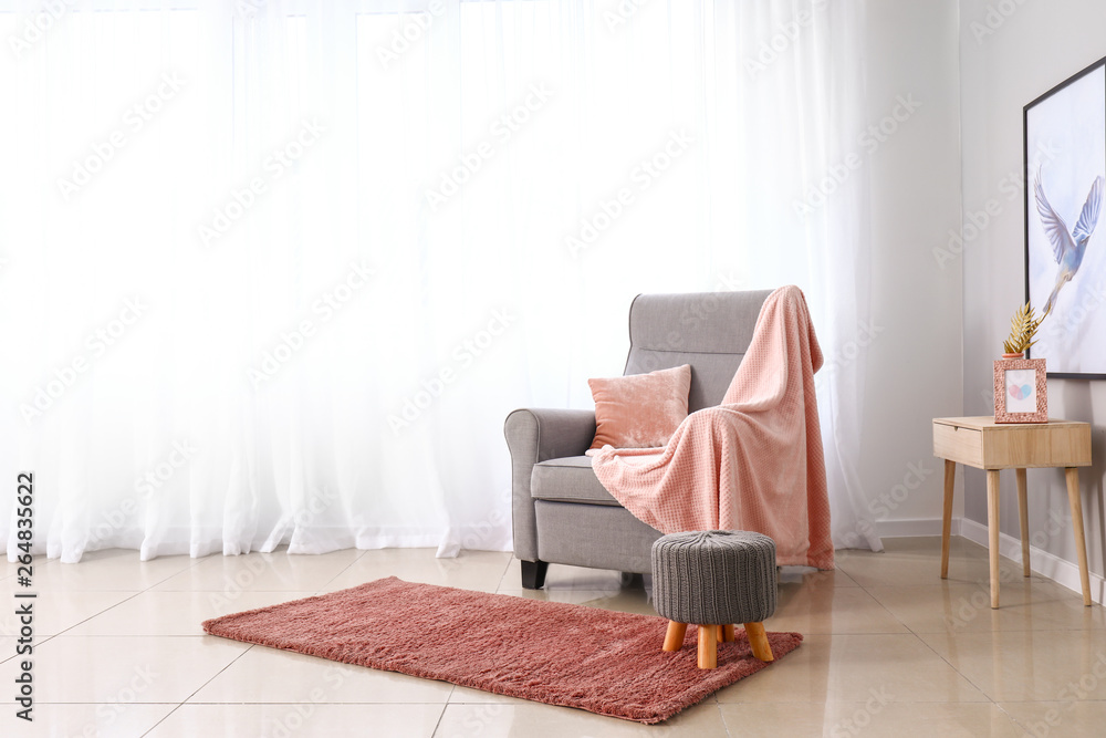Light curtains with stylish furniture in interior of room