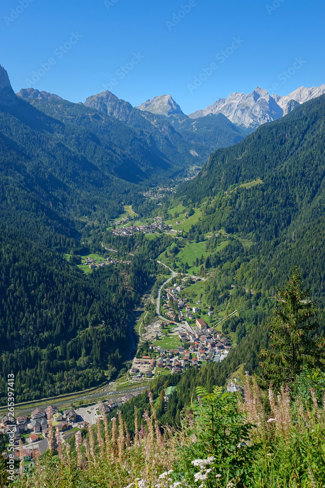 DRONE: Flying above a quiet village in the breathtaking Dolomites on a sunny day