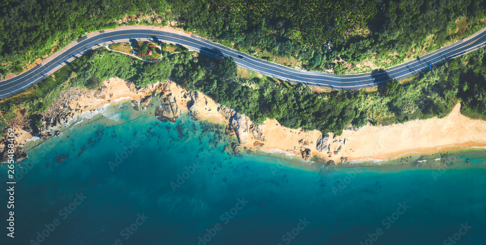 Aerial view of the sandy beach and  road