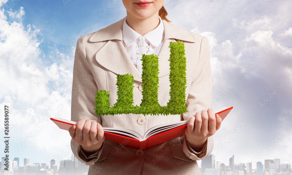 Woman with green plant shaped financial graph