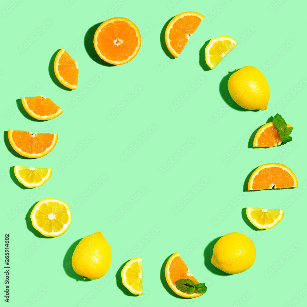 Round frame of oranges and lemons overhead view flat lay